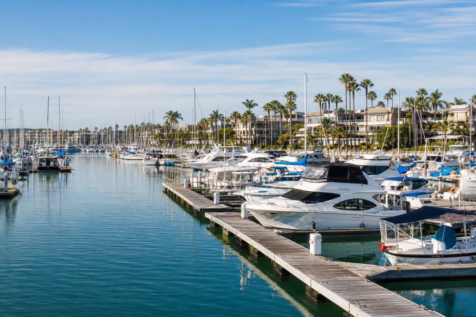 Southern California marina filled with boats along the dockside service corridor