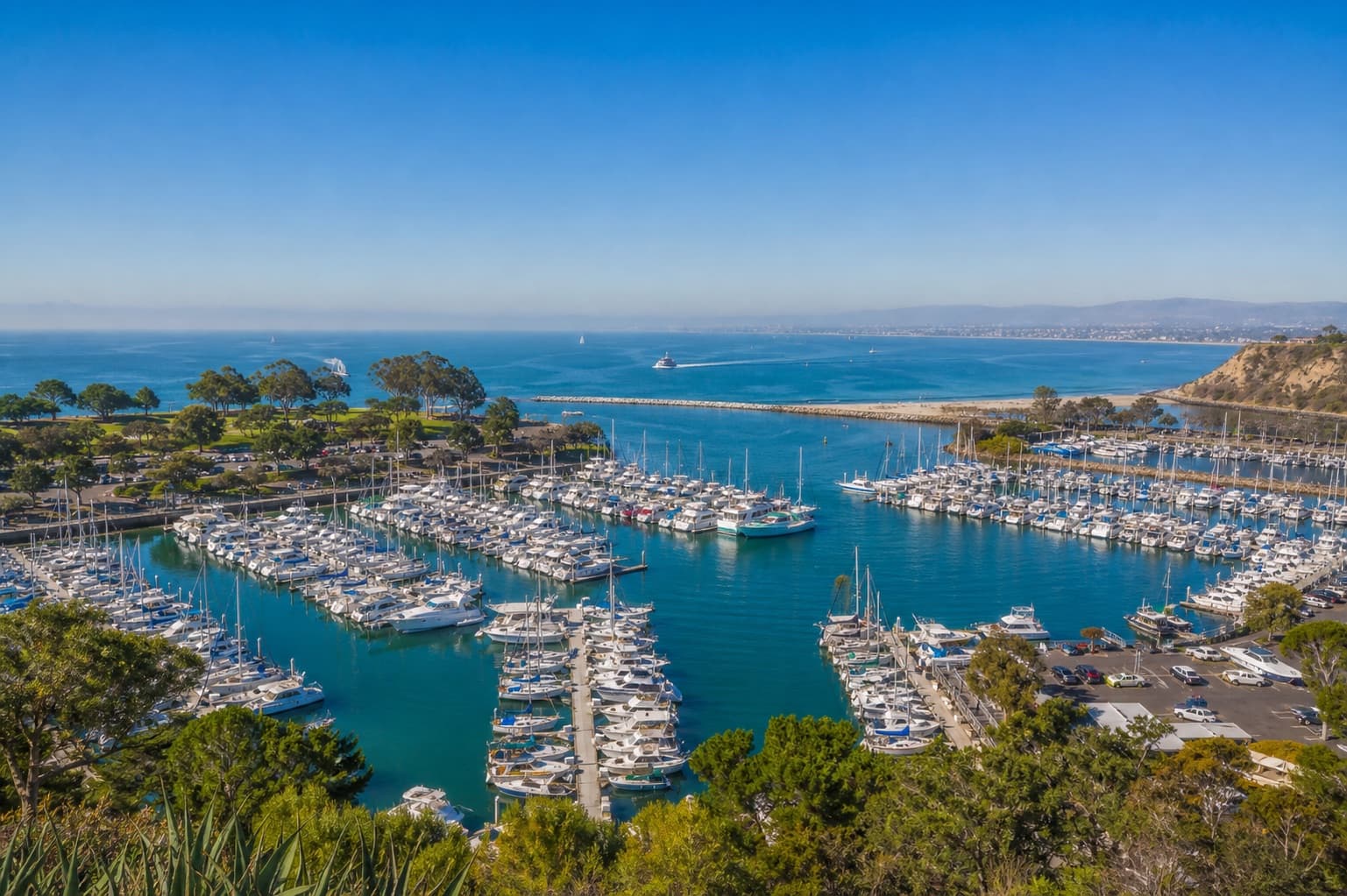 Bright aerial view across a Southern California marina and coastline